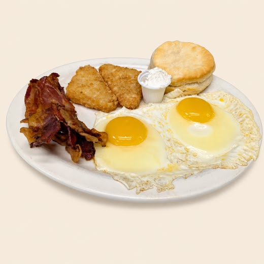 Two egg breakfast with bacon, hash browns, and a biscuit